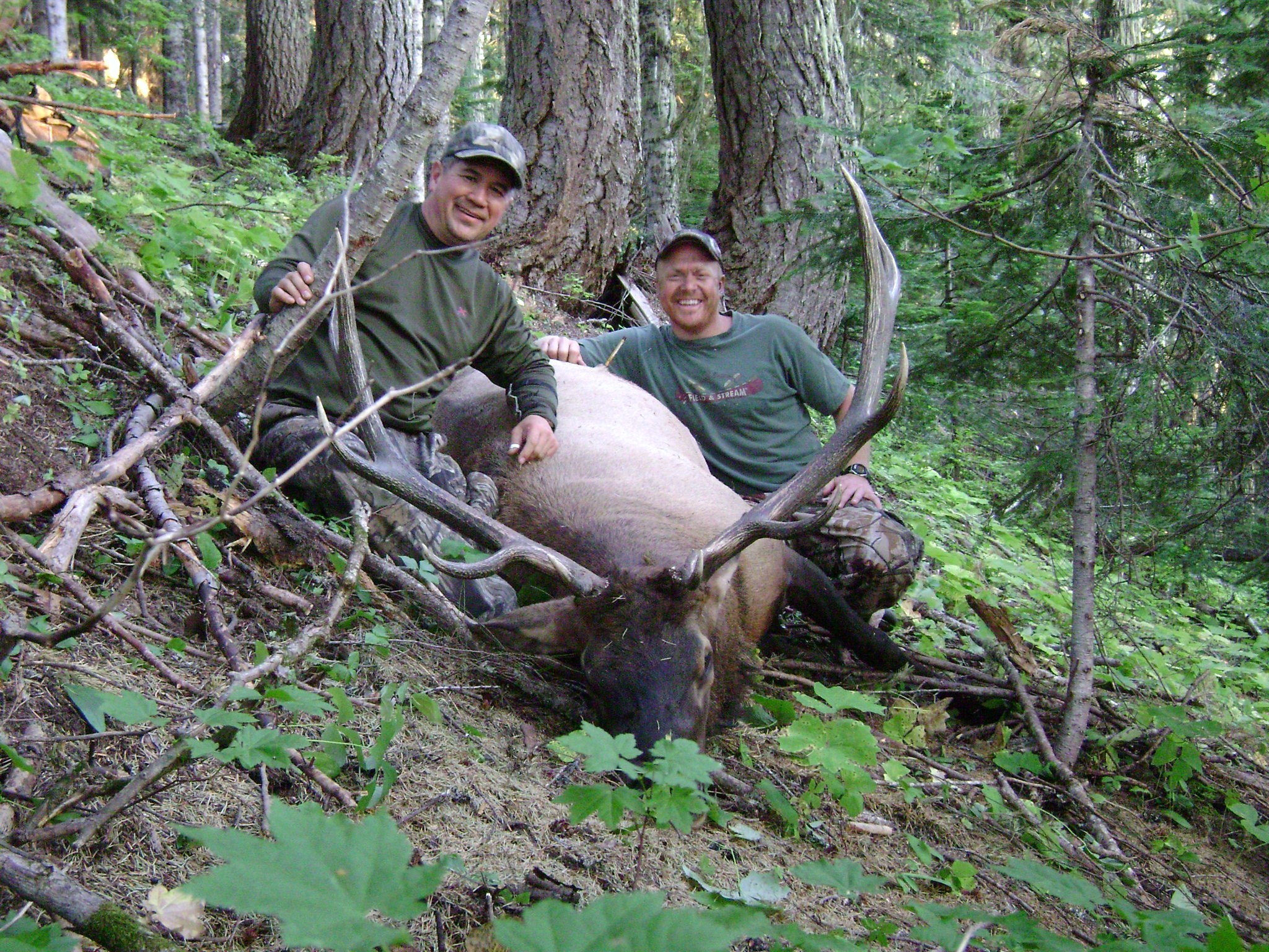 Rich Sandstrom (uphill) and me with my first elk.
